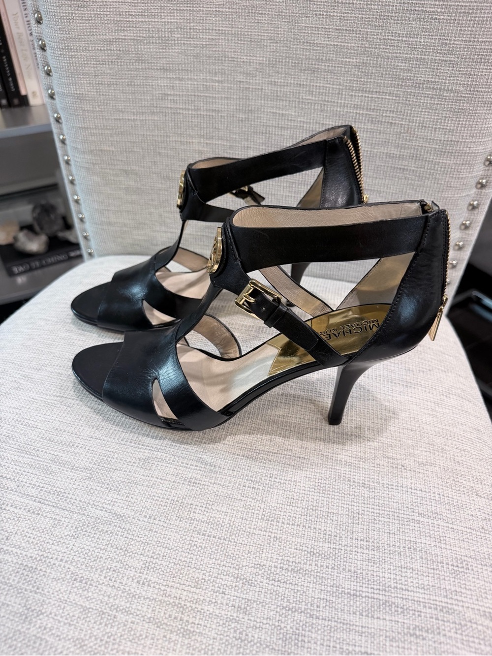 Michael Kors Black Leather Strappy T‑Heel Sandals with Gold Accents